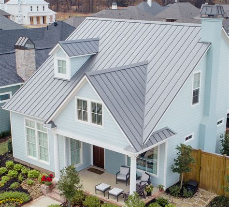 charcoal metal roof on white house 